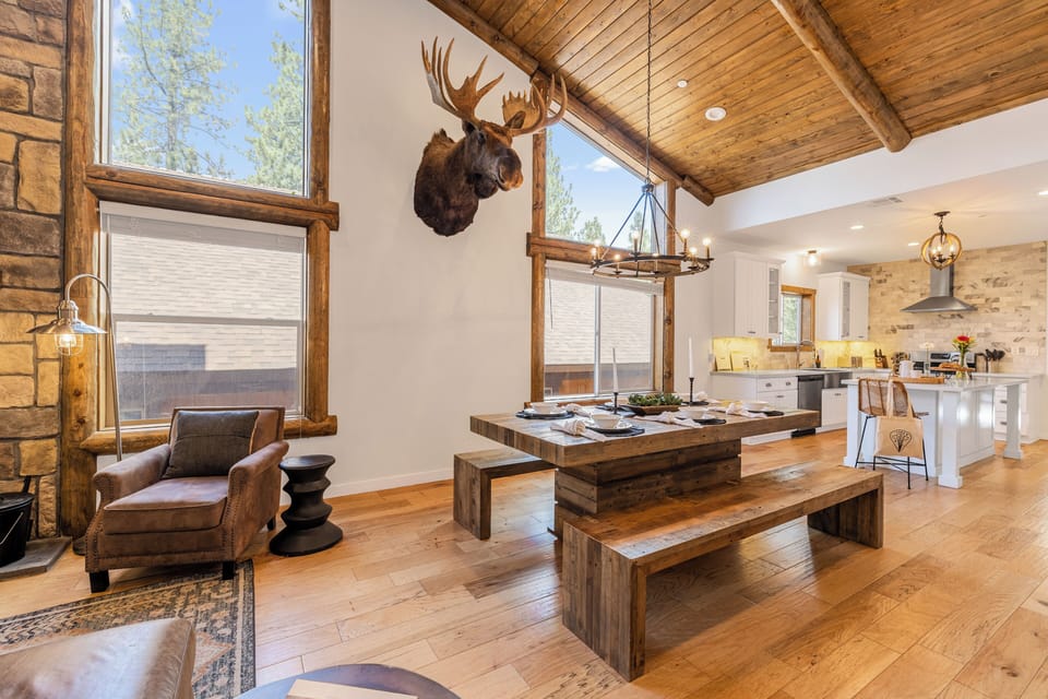 Vaulted ceilings and large windows add tons of natural light to the common area.