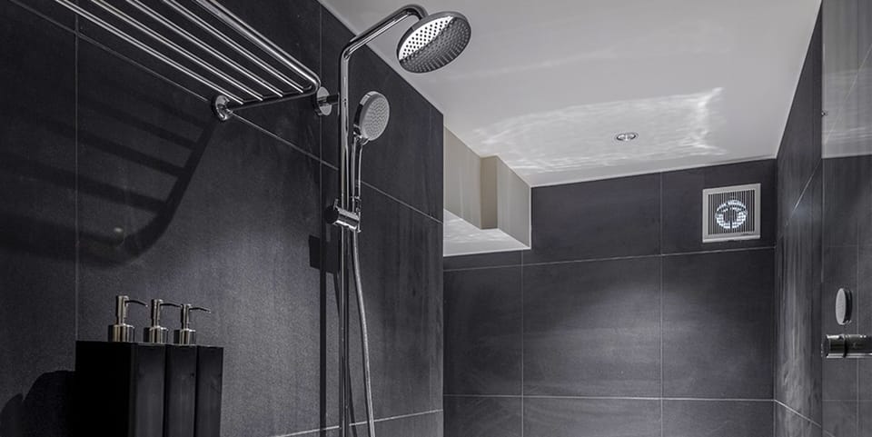 Separate tub and shower, rainfall showerhead, free toiletries
