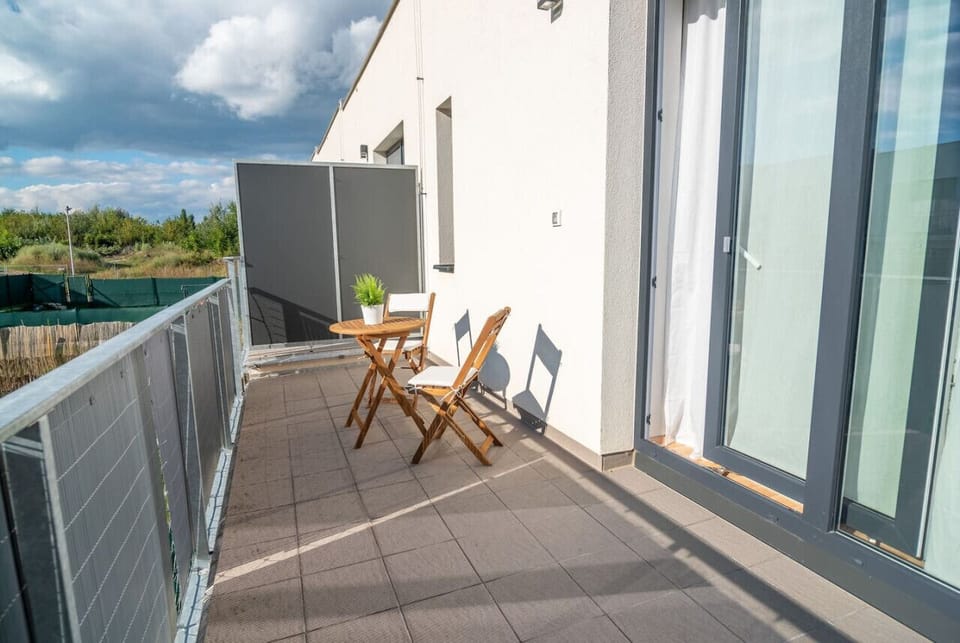 Upstairs balcony with view of garden
