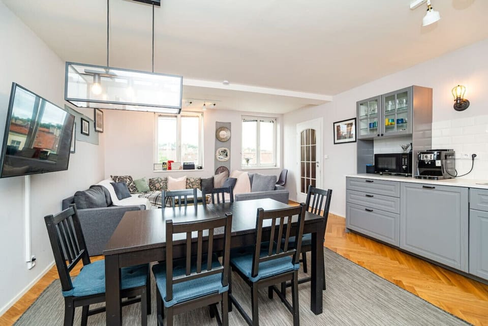 Table extends by up to 60% for seating more guests. Additional seats are spread around the flat.