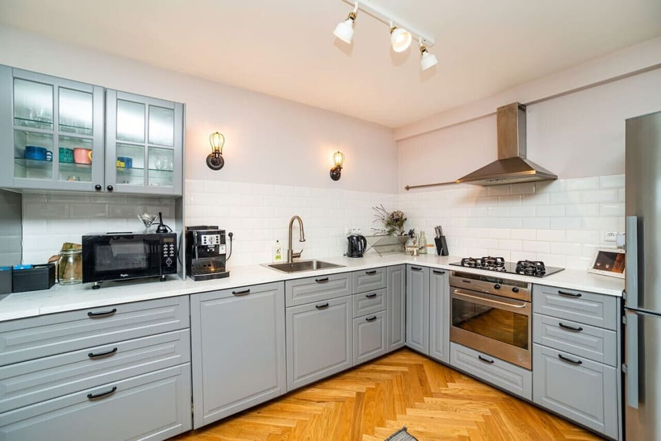 Kitchen with large fridge/freezer, gas stove, microwave and bean-to-cup coffee machine