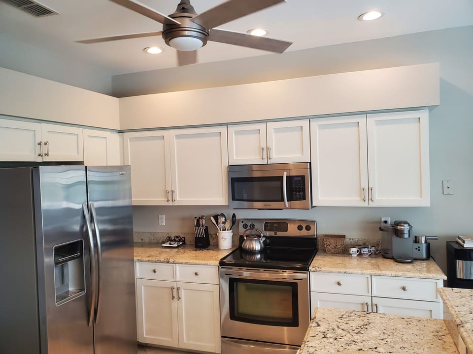 Kitchen with stainless steal appliances and all essentials for at home cooking