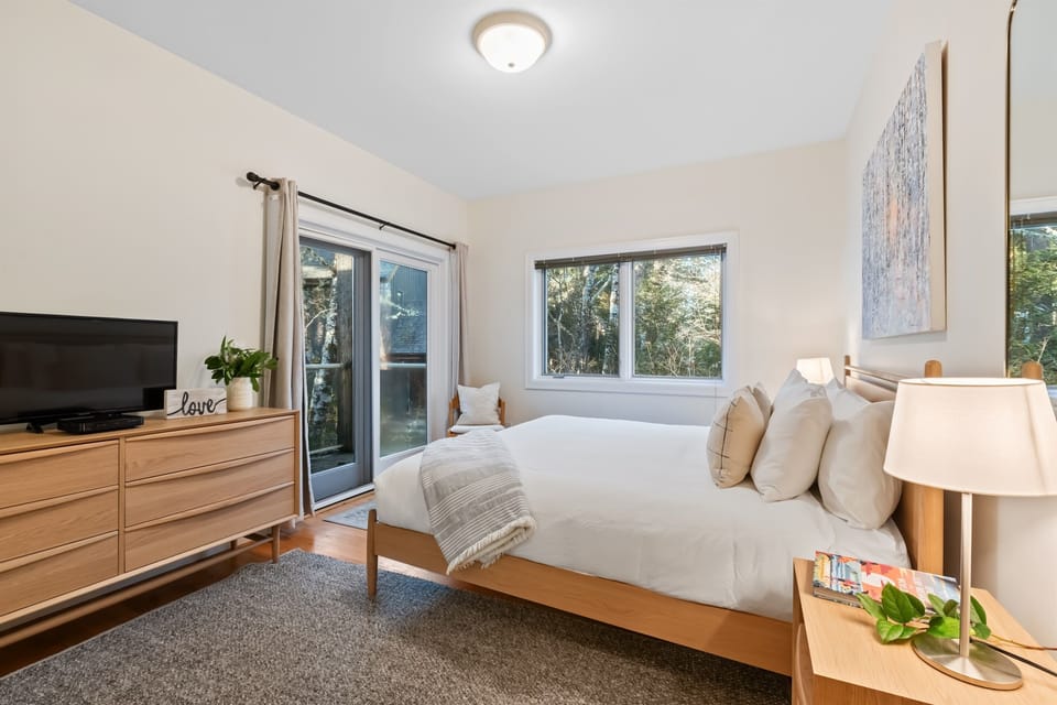 Bright, spacious room with a TV