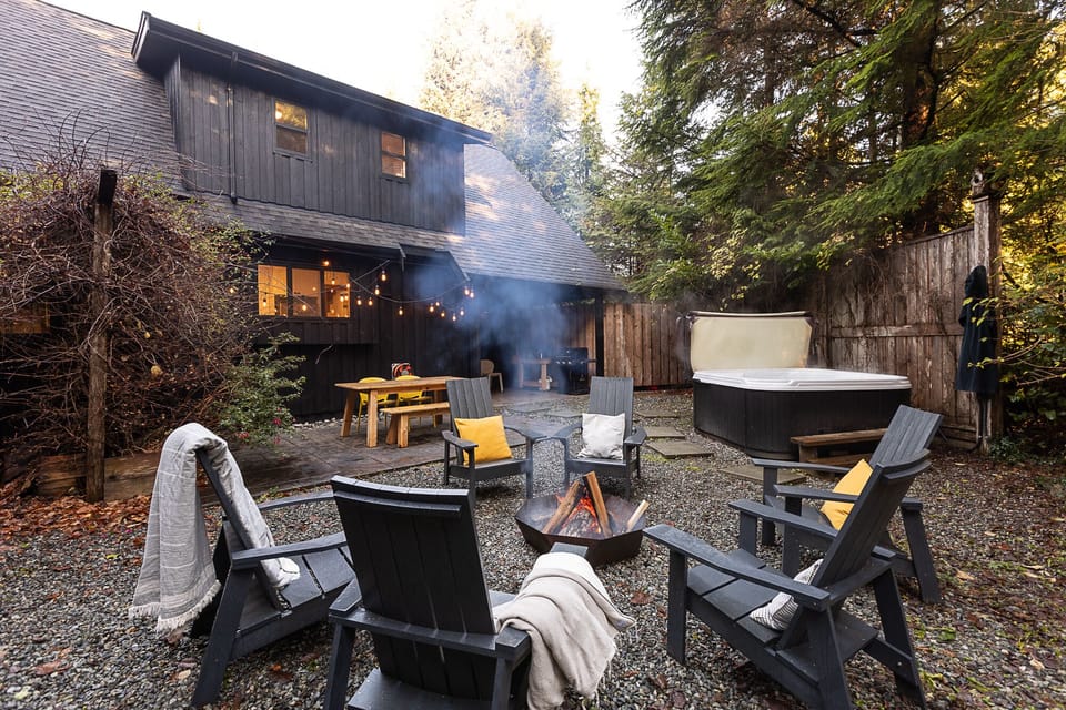 Fire pit with a private hot tub and seating