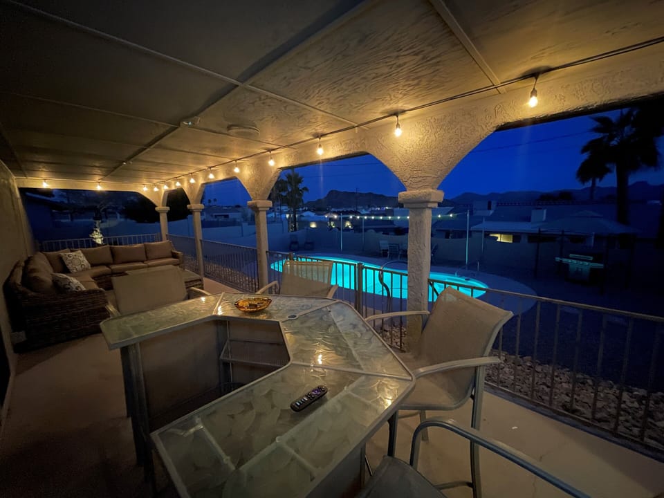 Relax at night under the lights as you look out at the mountains and pool