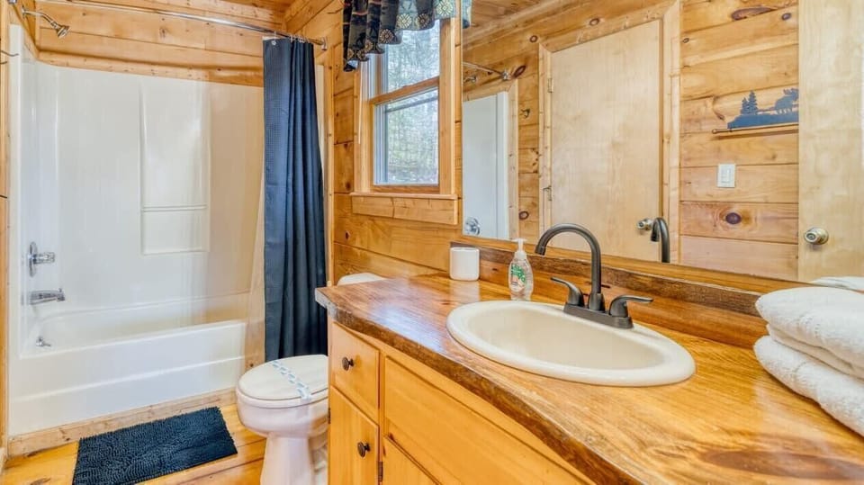 Cozy bathroom with elegant wooden details