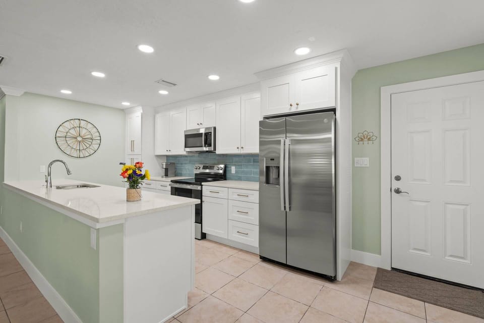 Newly updated kitchen with stainless steel appliances.