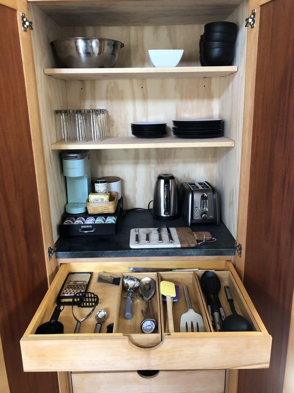 Stocked Keurig, toaster, teapot and items to bake and crack seafood