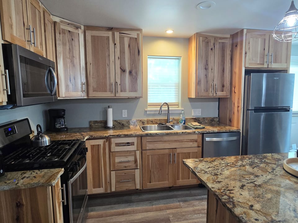 Modern appliances in the well equipped kitchen make meal prep a pleasure