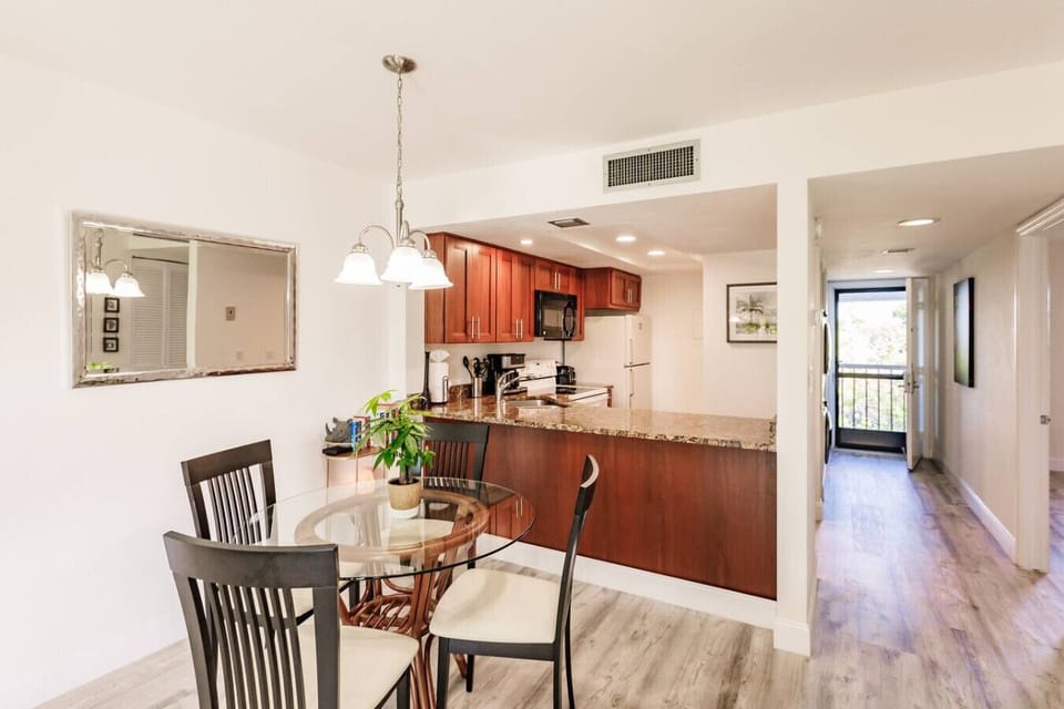 Dining table & kitchen.