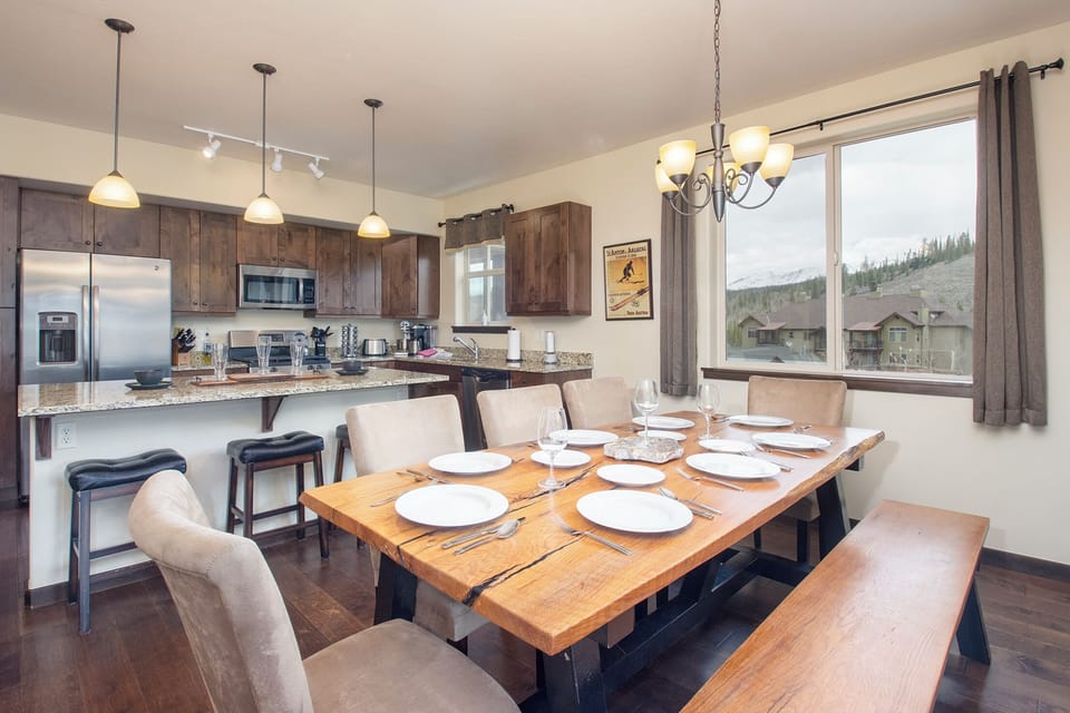 Your open kitchen flows into a cozy dining space where mountain views frame every meal.