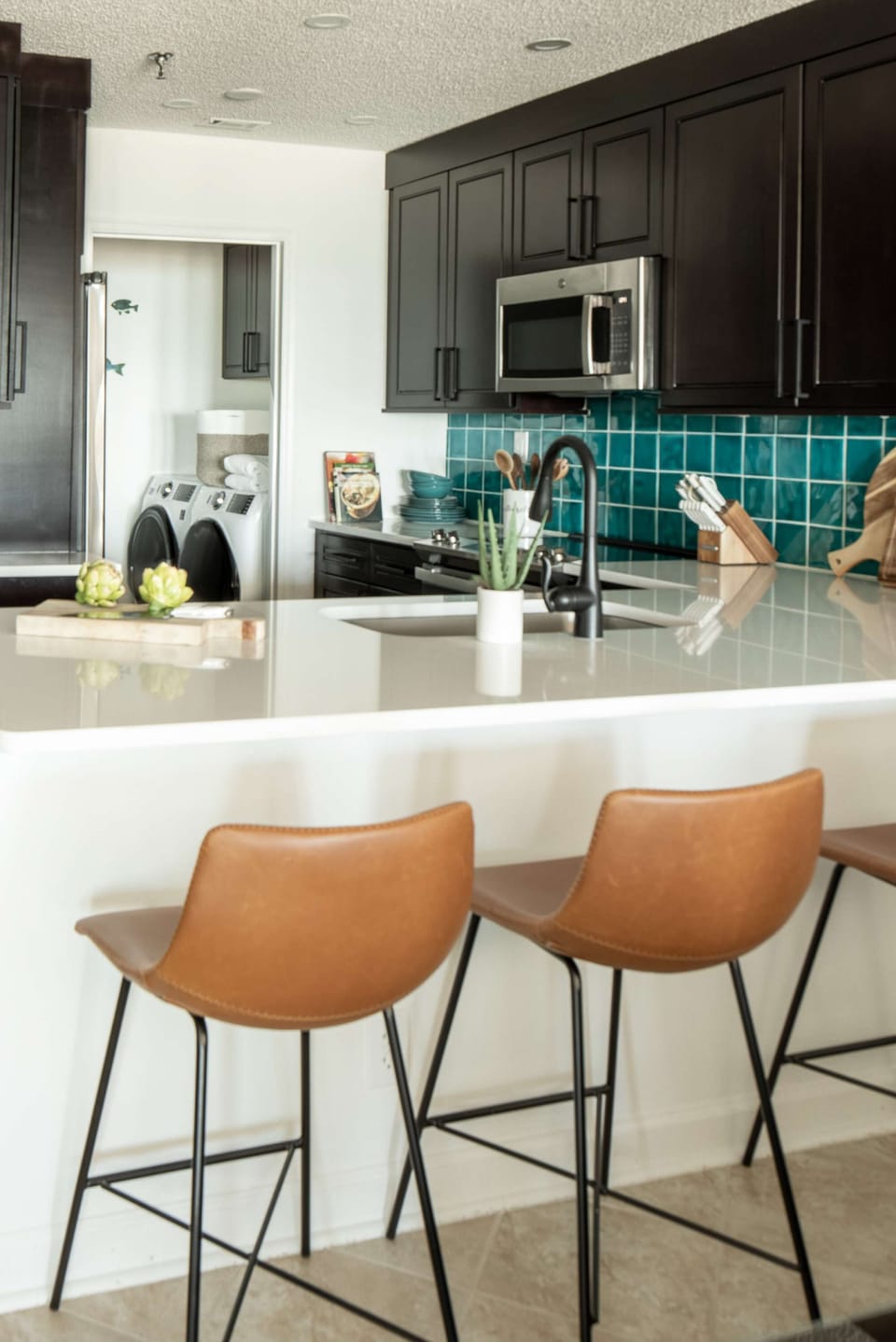 Large Peninsula with four leather barstools!
