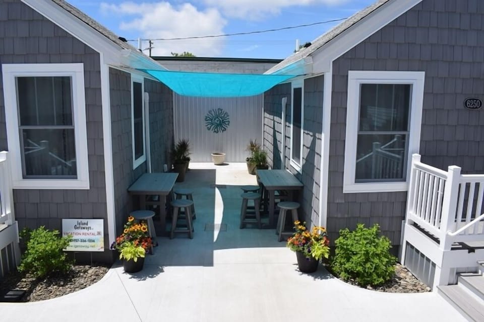 Enjoy a fantastic outdoor space with a sun-sail shaded lounge area and a picnic spot complete with grills - ideal for relaxing or entertaining.