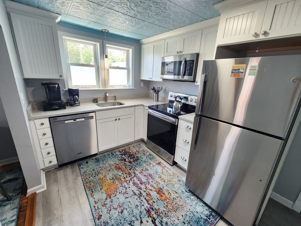 A fully equipped kitchen stocked with everything you need to cook and dine comfortably at home.