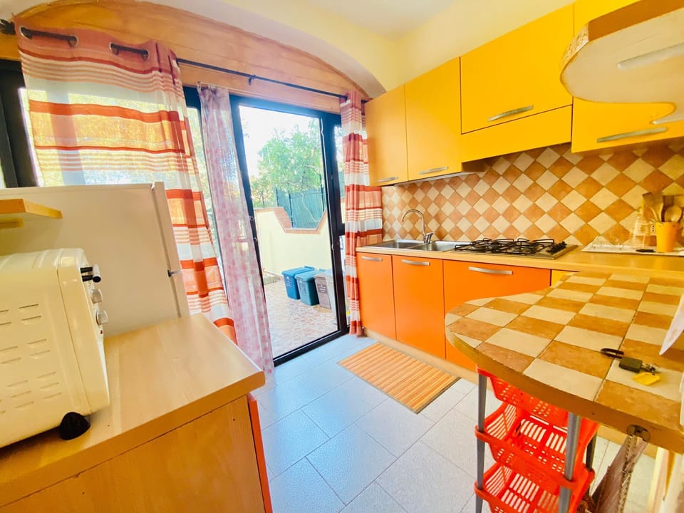 Apartment, 2 Bedrooms | Private kitchen | Full-size fridge, stovetop, cookware/dishes/utensils, dining tables