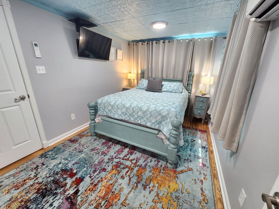 En-suite bedroom with a queen bed for a cozy and restful stay.