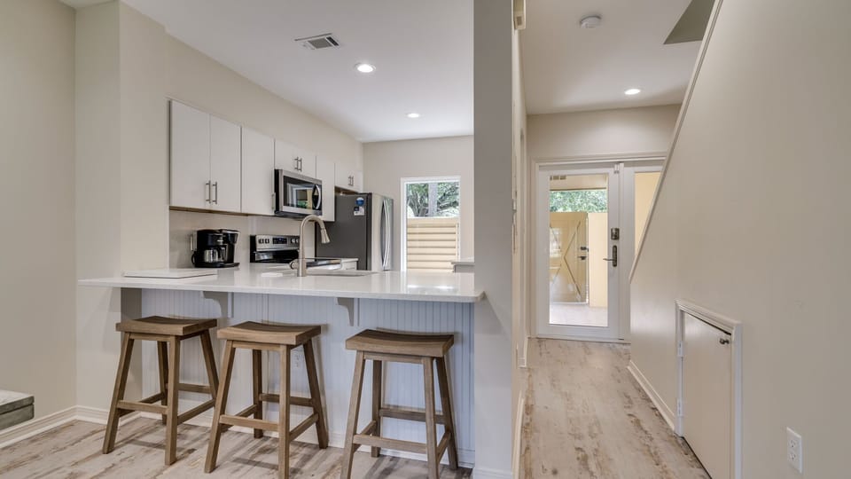 View to front door and kitchen