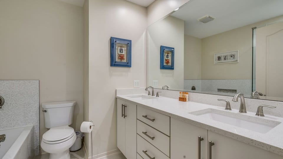 Master bath contains double sinks with separate tub and shower