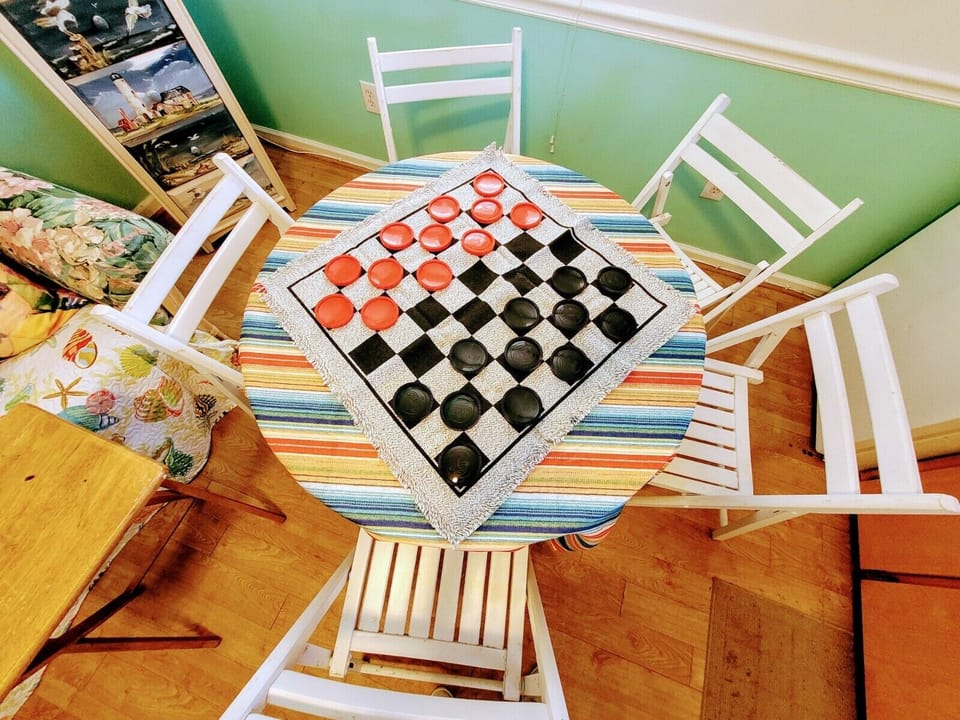 tic tac toe, checkers for fun family time, 5 dining chairs plus 2 tray tables