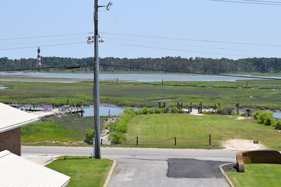 Balcony overlooking.  the pool, Assateague Channel & Lighthouse.
