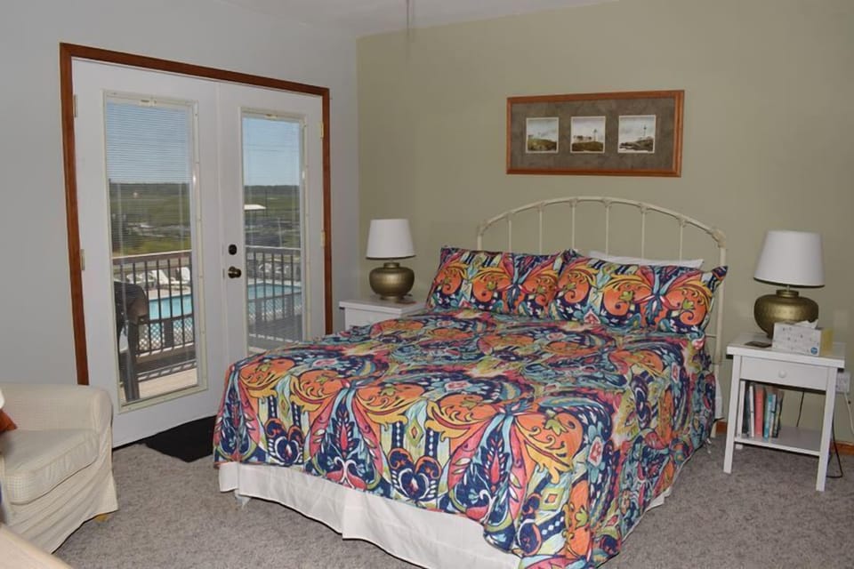 Main queen bedroom has a private bath and balcony overlooking.