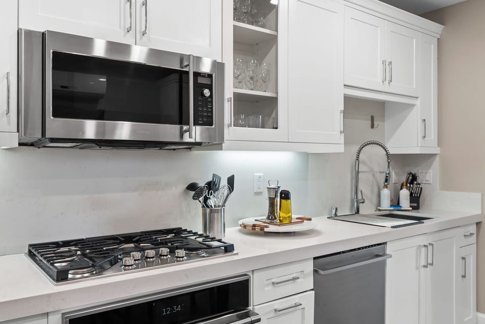 Open-concept kitchen and dining area featuring modern appliances, a spacious dining table, and plenty of room to cook, share meals, and enjoy time together.