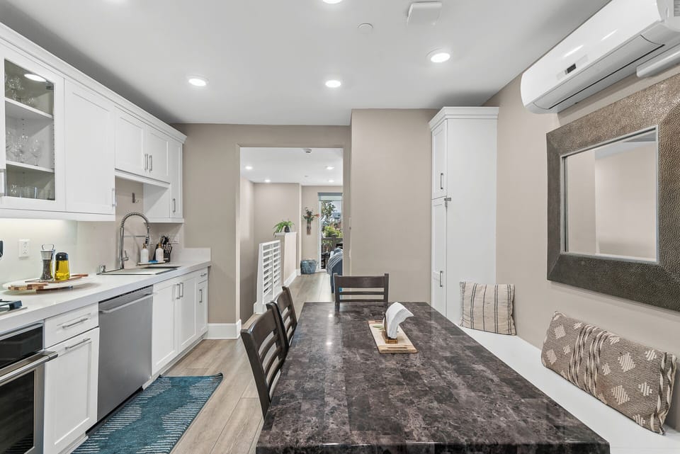 Open-concept kitchen and dining area featuring modern appliances, a spacious dining table, and plenty of room to cook, share meals, and enjoy time together.
