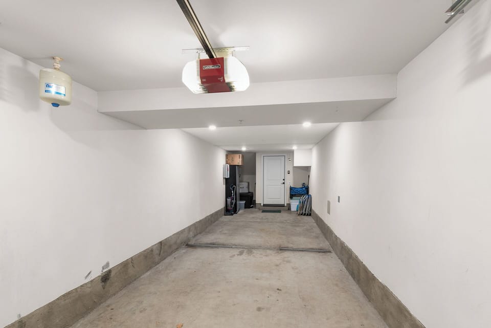 Spacious tandem garage offering convenient, secure parking for two vehicles or extra storage during your stay.