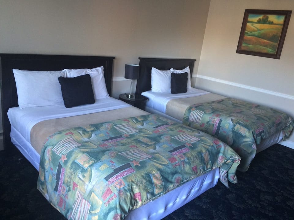 Standard Room, 2 Double Beds | Iron/ironing board, rollaway beds, free WiFi