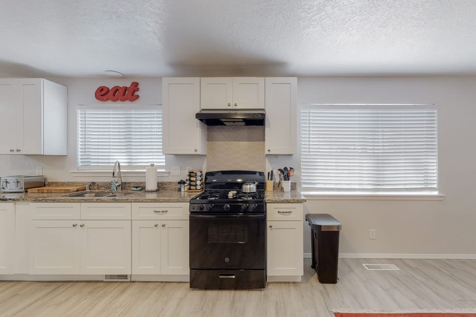 Kitchen with lots of natural light,  new appliances,  and fully stocked! 