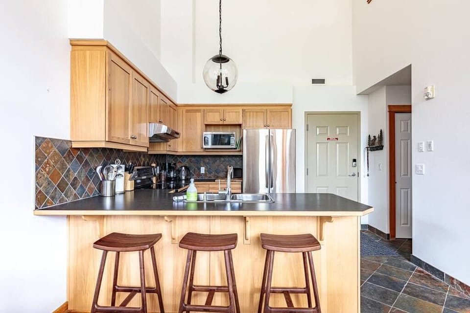 Start your mornings here at the breakfast bar with coffee, conversation, and comfort.