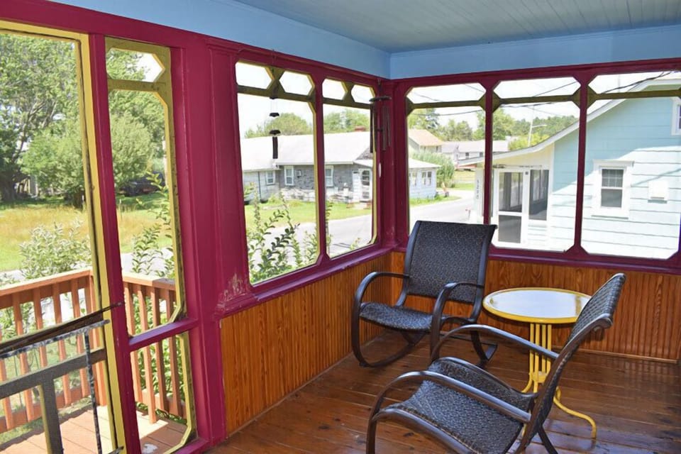Relax in the front screened porch.