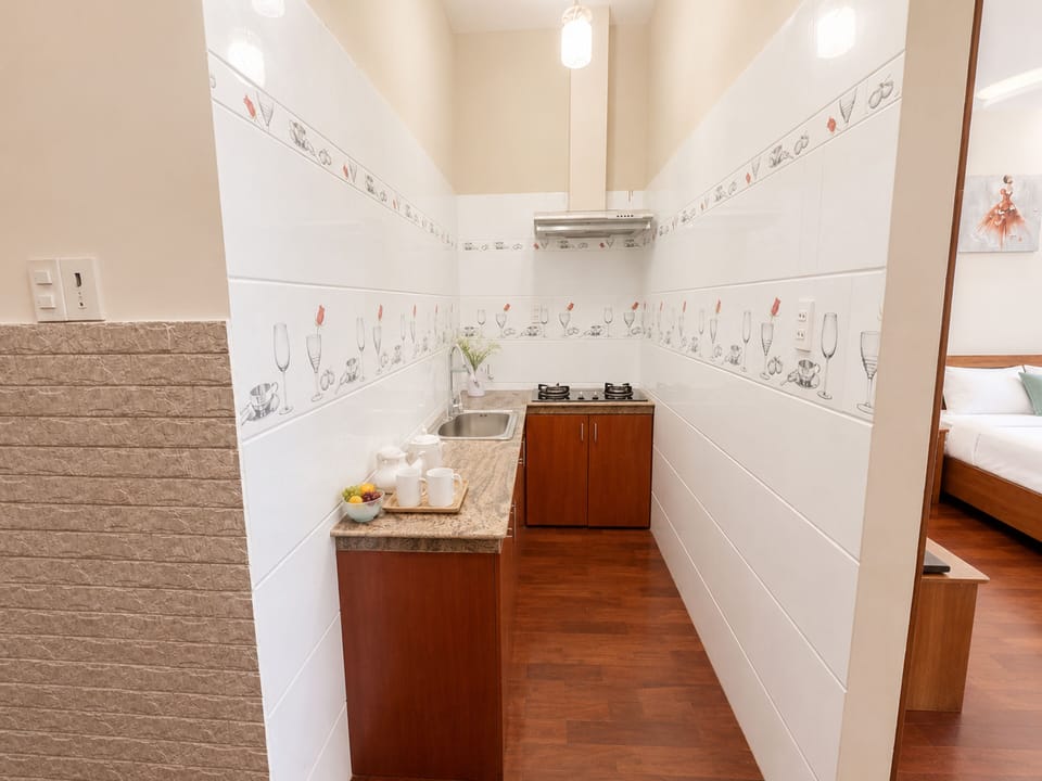 Family Suite | Private kitchen | Mini-fridge, electric kettle, paper towels