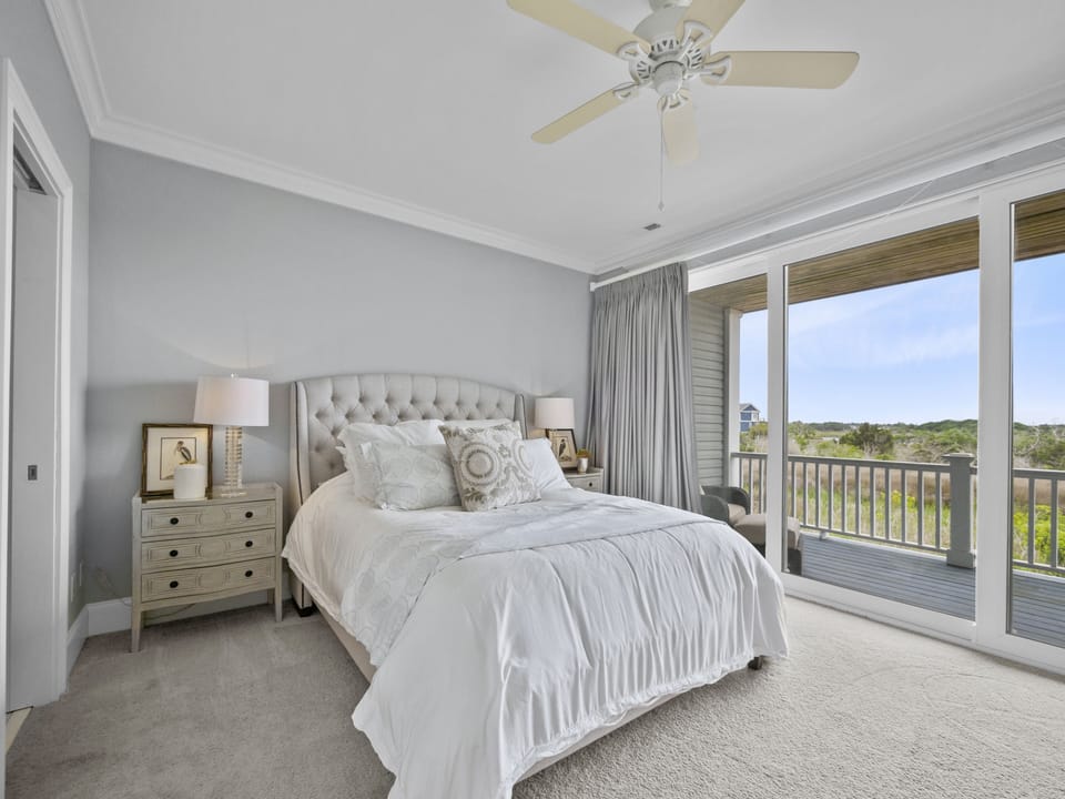 Large master queen bedroom with a private deck and views of the Intracoastal
