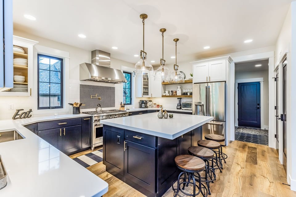 Savor the beauty of nature while cooking in this expansive, high-end mountain kitchen