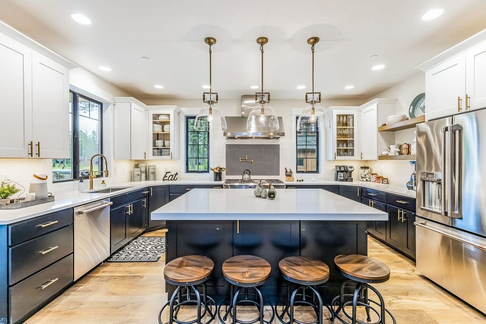 Stylish modern kitchen with a appealing center island and 4 bar chairs