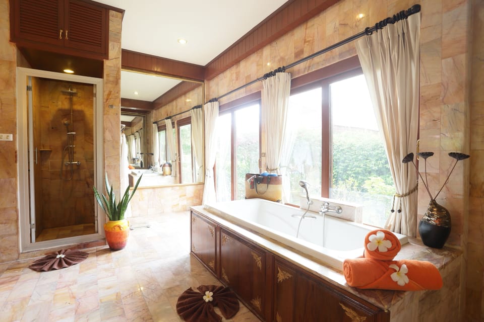 Seaview Villa | Bathroom | Separate tub and shower, hair dryer, bathrobes, slippers