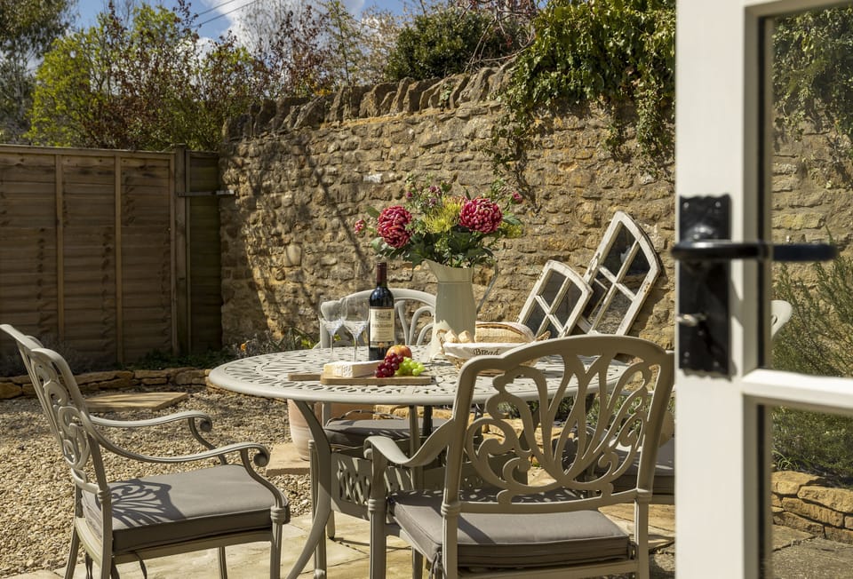 French doors lead from the sitting room to the sunny walled garden