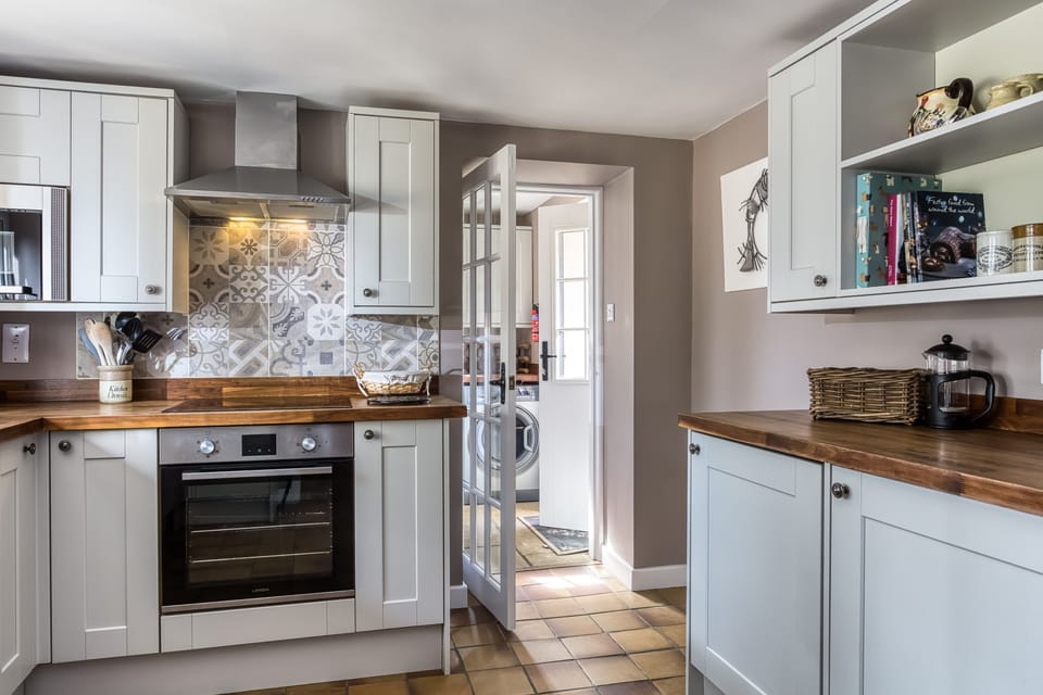 The kitchen leading out to the utility room