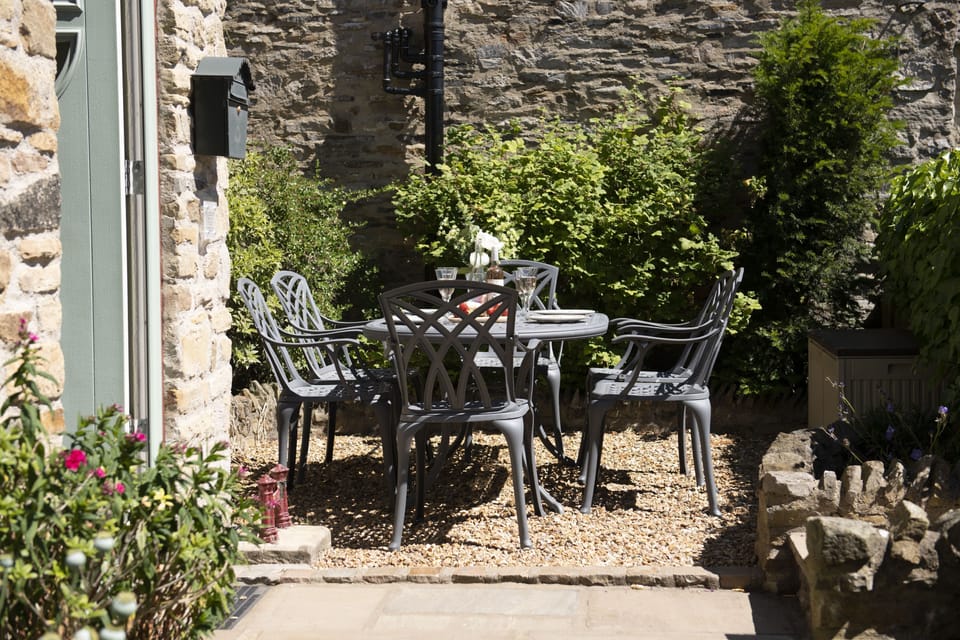 Theaked Stones Cottage, near Leyburn: South facing front garden with seating area for six guests