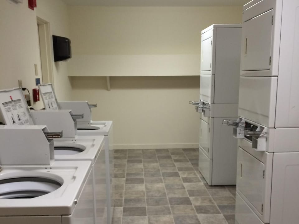 Coin laundry at end of hallway