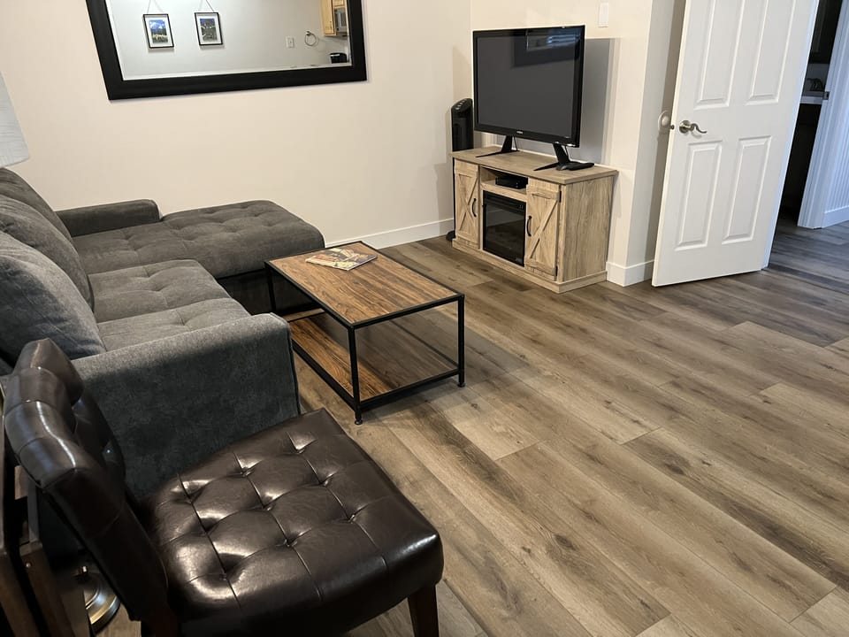 Living Room with fireplace and TV with cable
