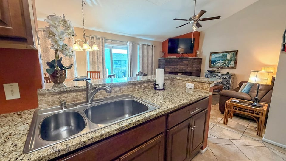 Open kitchen flows seamlessly into your cozy living space, perfect for preparing meals while staying connected with family and friends.