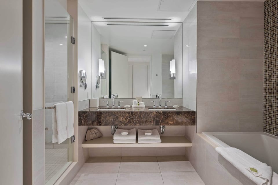 Deluxe Room, 1 King Bed | Bathroom | Designer toiletries, hair dryer, bathrobes, slippers