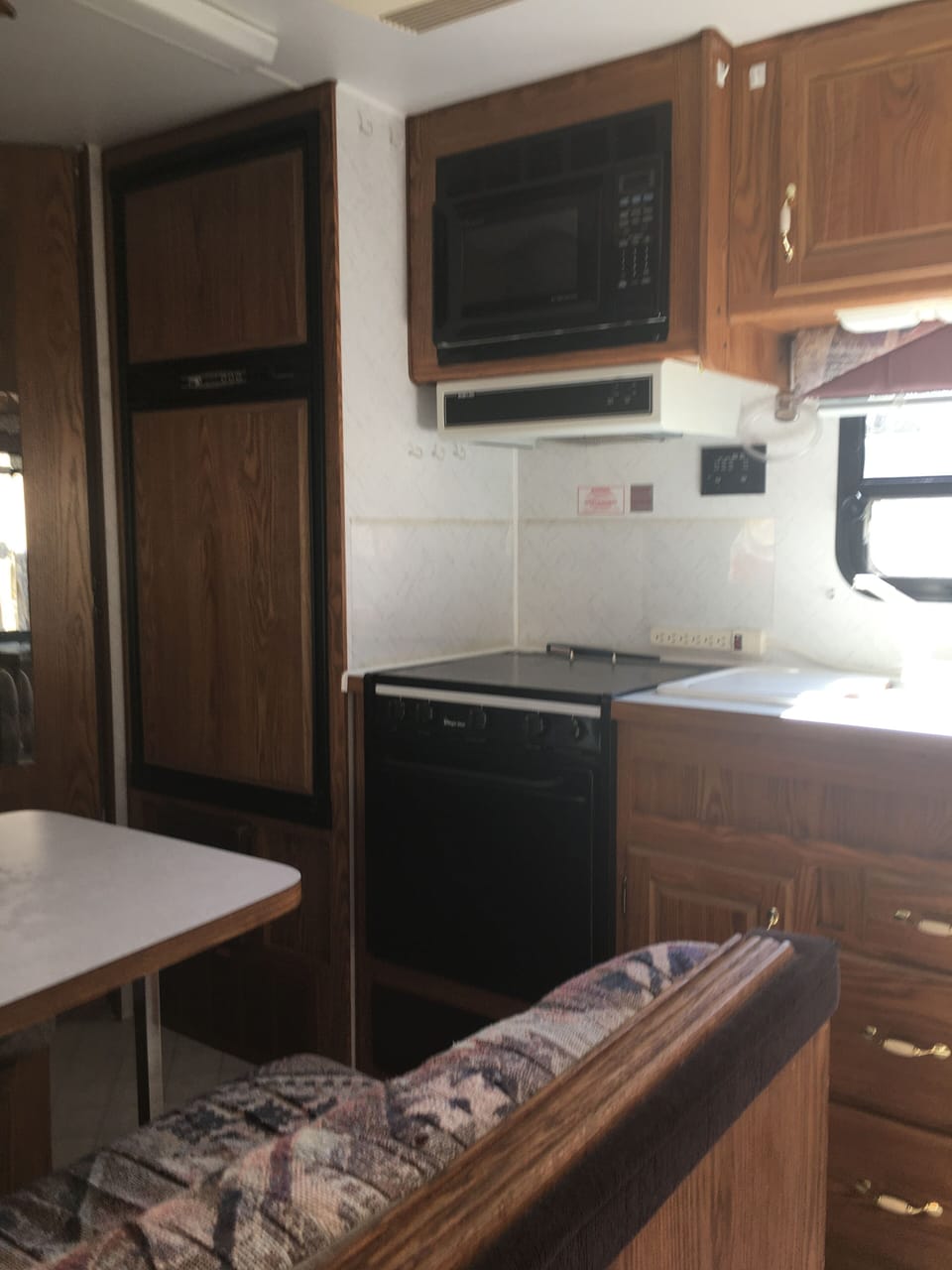 Full functioning kitchen with stove, oven and microwave. 