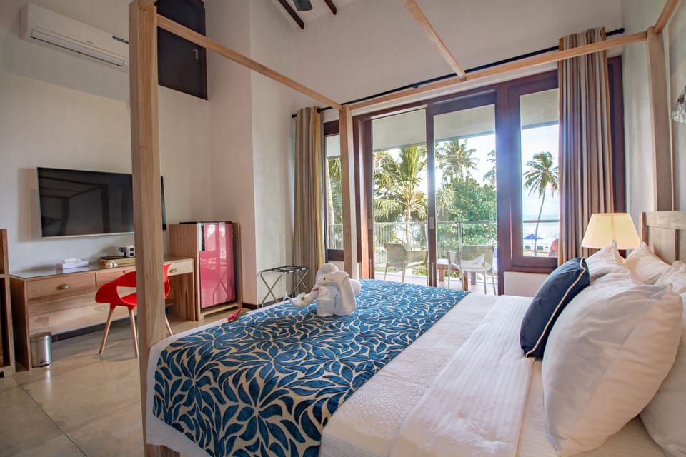 Family Quadruple Room, Beach View | In-room safe, desk, soundproofing, free WiFi