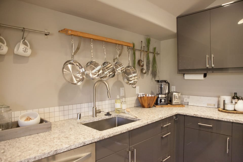 Fully stocked kitchen complete with small ample small appliances and cookware