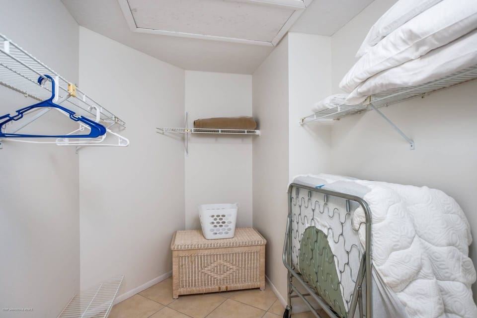 The master has a walk-in closet off the bathroom with a single cot for a short term guest