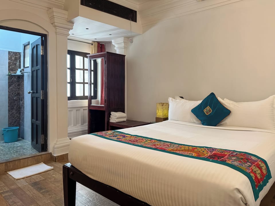 Classic Double Room | Minibar, in-room safe, iron/ironing board, rollaway beds