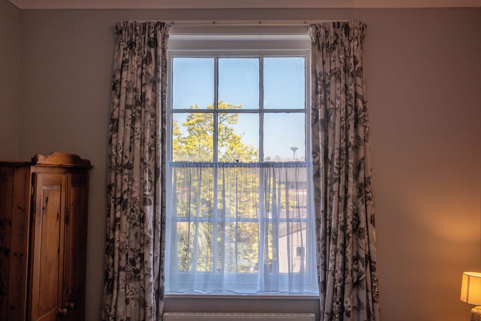 Bedroom with view of Magnolia tree